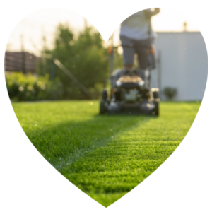 A man mowing a lawn.
